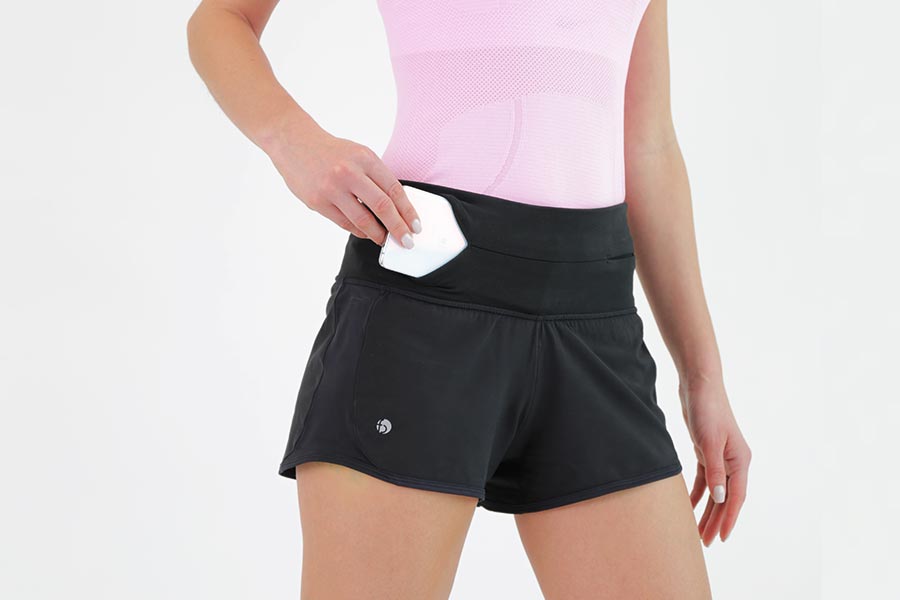 inserting phone into the flipbelt running shorts